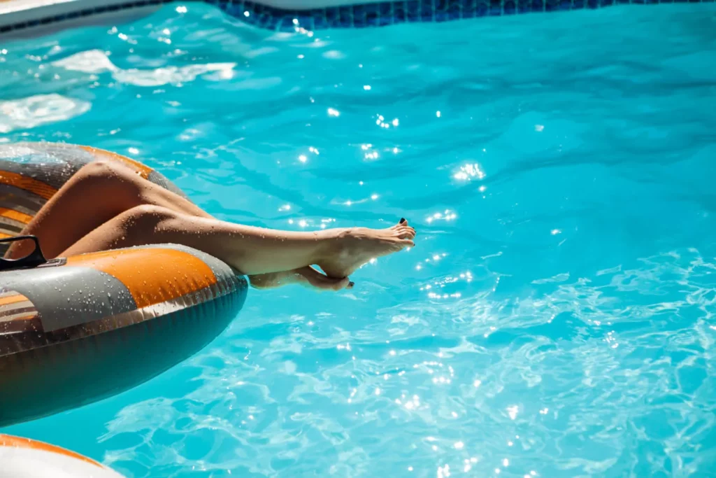 close up photo woman s legs swimming pool 1